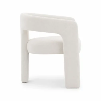 Left side view of the Dalpat Rustic Iron Arm Chair featuring premium bouclé upholstery and contemporary architectural styling in Dubai UAE.