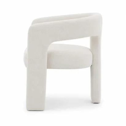 Right side profile of the Dalpat Rustic Iron Arm Chair with soft bouclé upholstery and minimalist designer aesthetics by Ansary Furniture UAE.