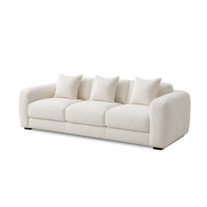 Luxury white upholstered 3-seater living room sofa featuring plush cushions and rounded armrests.