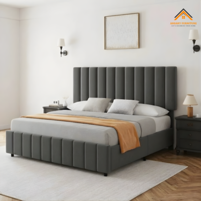 Grey fabric platform bed with matching side rails.
