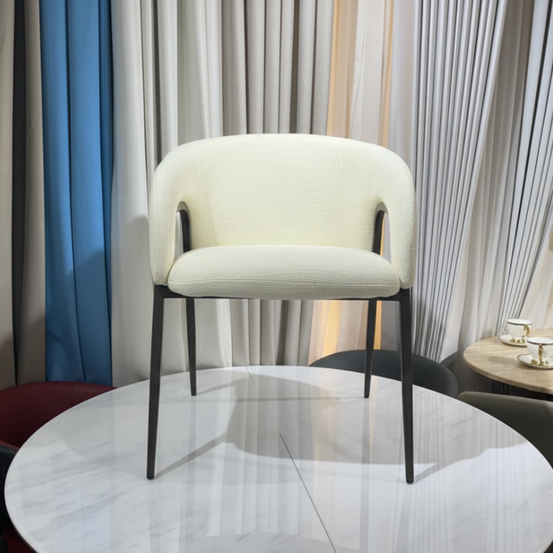 Side profile of modern textured bouclé accent chair