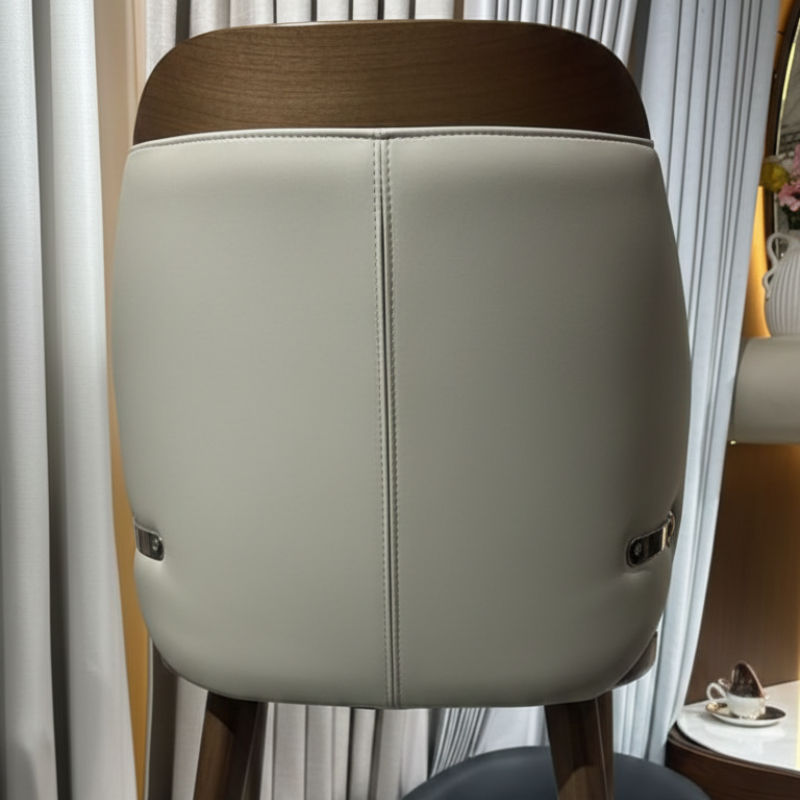 Upholstered Cream Faux Leather Dining Chair for Dubai apartments.
