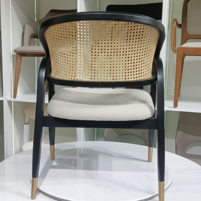 Minimalist rattan back accent chair.