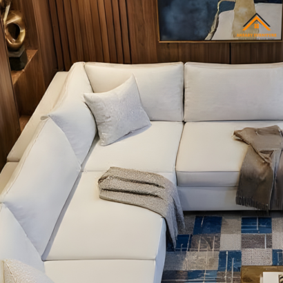 Minimalist L-shaped sectional sofa featuring plush cushions and neutral tones for high-end homes in Dubai, UAE.