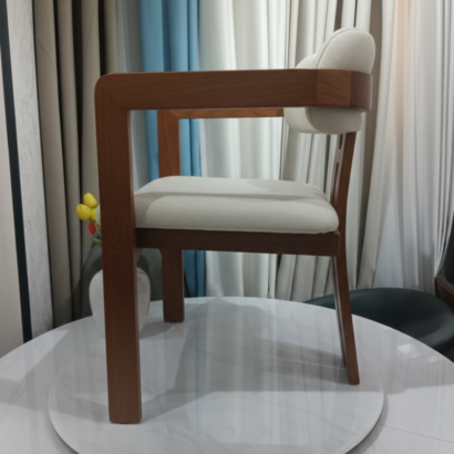 1. Modern solid wood dining chair with cream upholstery Dubai.