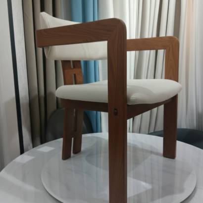 5. Modern wooden armchair for luxury dining room decor Dubai.