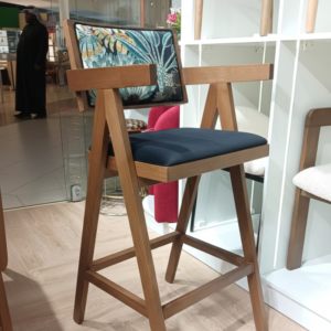 High-back counter chair with black velvet seat.