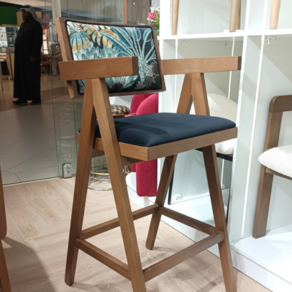 High-back counter chair with black velvet seat.