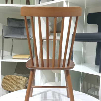 Solid wood spindle-back dining chair in walnut finish.