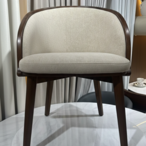 Ergonomic barrel-style dining chair by Ansary Furniture.