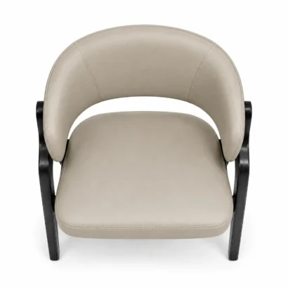 Top view of beige upholstered dining chair showing curved backrest and stitched seat