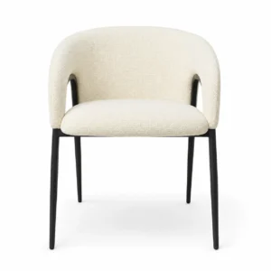 Cream bouclé dining chair with curved upholstered back and black metal legs