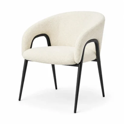 Cream bouclé upholstered dining chair with curved arms and slim black legs