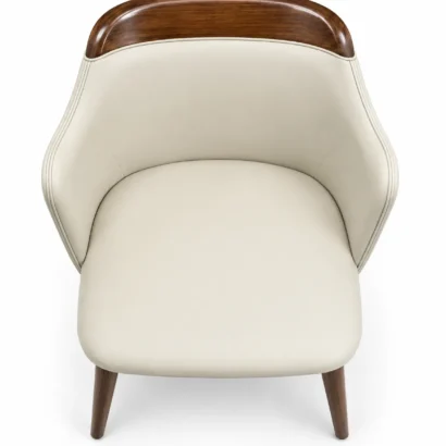 Front view of cream faux leather dining chair with curved wooden backrest