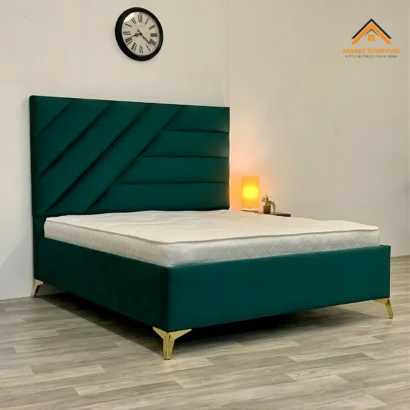 Luxury teal bedroom bed with gold metal legs and upholstered headboard