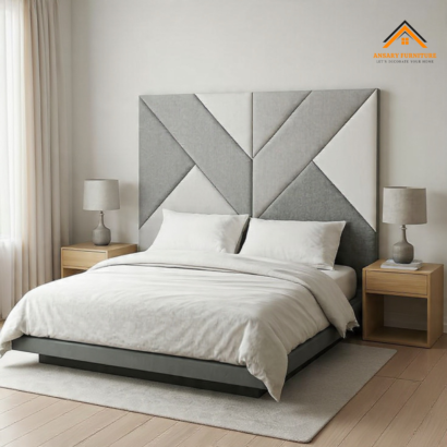 Modern luxury bedroom furniture in UAE featuring a custom grey geometric panelled headboard.