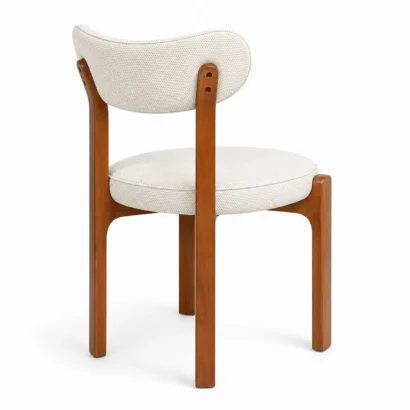 Rear view of a modern upholstered dining chair with a curved backrest and wooden legs