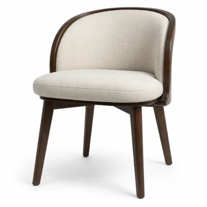 Serene barrel dining chair with cream fabric upholstery in a modern dining setting