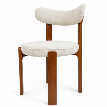 Side view of a cream upholstered dining chair with warm wooden legs