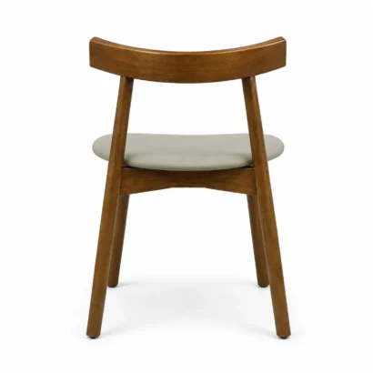 Back view of a modern wooden dining chair featuring a curved wood backrest and upholstered seat