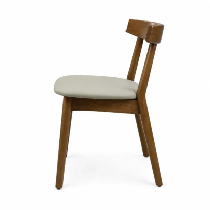 Right side view of a modern wooden dining chair with beige cushioned seat in Dubai