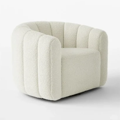 White bouclé swivel accent chair with curved barrel design by Ansary Furniture.