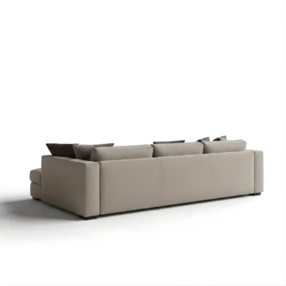 Elegant Chesterfield Sofa Dubai featuring soft fabric upholstery, deep seating, and a contemporary chaise lounge design.