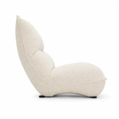 Cream bouclé lounge chair left side view with curved back and upholstered seat