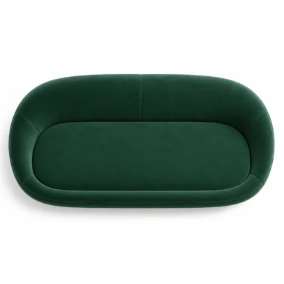 Top view of curved emerald green velvet sofa Dubai