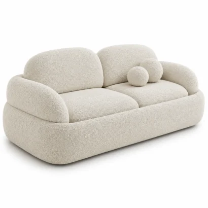 Puffed boucle sofa left side view with rounded arm and boucle upholstery