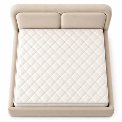 Top view of a beige upholstered bed frame with a diamond-quilted white mattress.