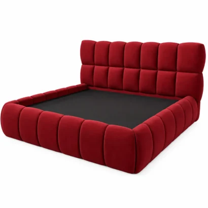 Side angle of burgundy upholstered platform bed showing padded rails and panel detailing