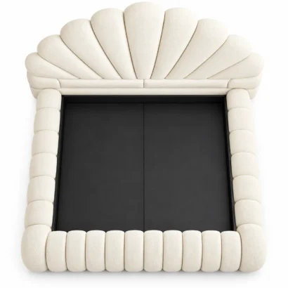 Top view of the cream upholstered bed frame showing padded side rails and footboard