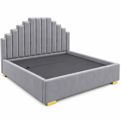 Grey stepped upholstered platform bed with vertical channel headboard and gold-tone legs