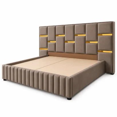 Taupe upholstered bed with gold accent details and vertical panel footboard Dubai UAE